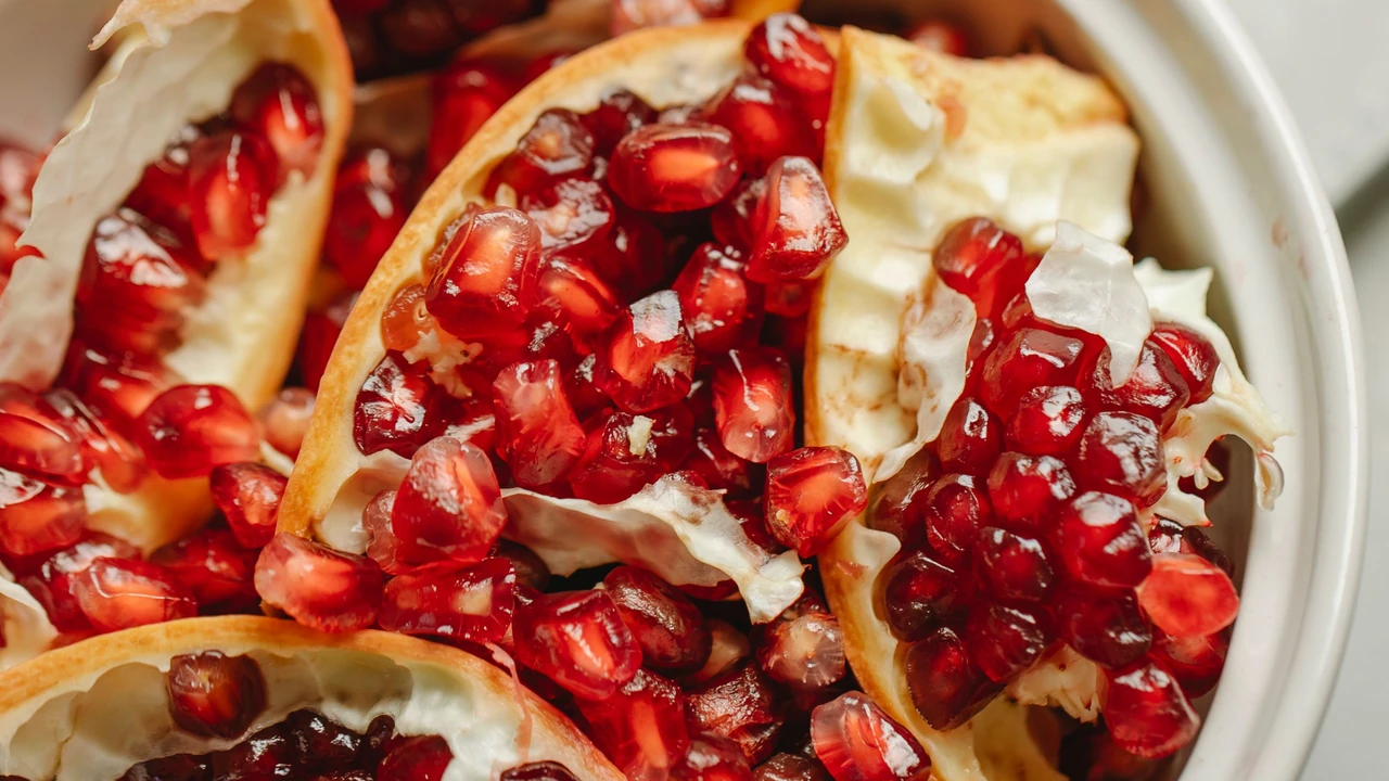 Nutrient-dense fresh fruit bowl combining fresh pomegranate arils and vitamin C rich fruits