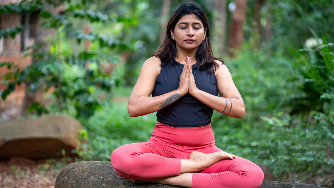 Person connecting with inner physical sensations and mindful bodily awareness during a relaxing therapeutic wellness session