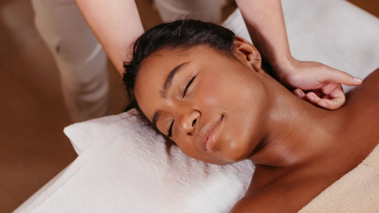 Client experiencing tranquil uninterrupted rest during a restorative therapeutic massage session helping slow breathing and cease multitasking