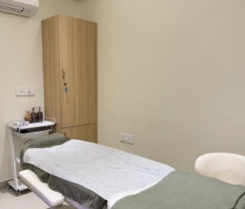 Sanitary clinical examination and treatment bed with fresh disposable drape at Dermis 365