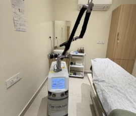 Advanced Q-Switched Nd:YAG laser with 7-joint articulated optical arm in sterile treatment suite